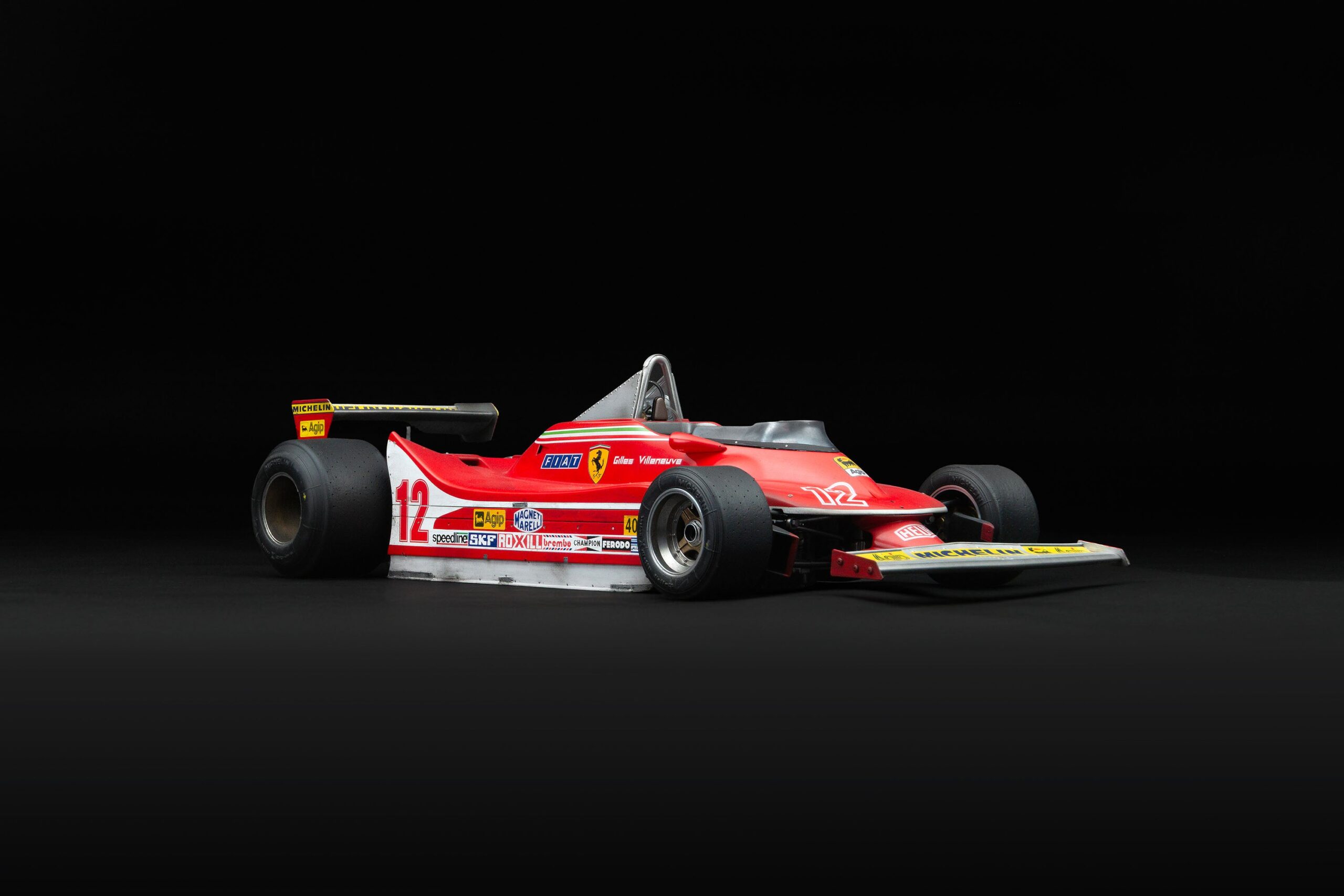 アマルガム フェラーリ 312 T4 1979 US東グランプリ ウィナー ジル・ヴィルヌーヴ レースウェザード - レッド | 1:8